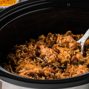 Pot of chicken, rice and beans.