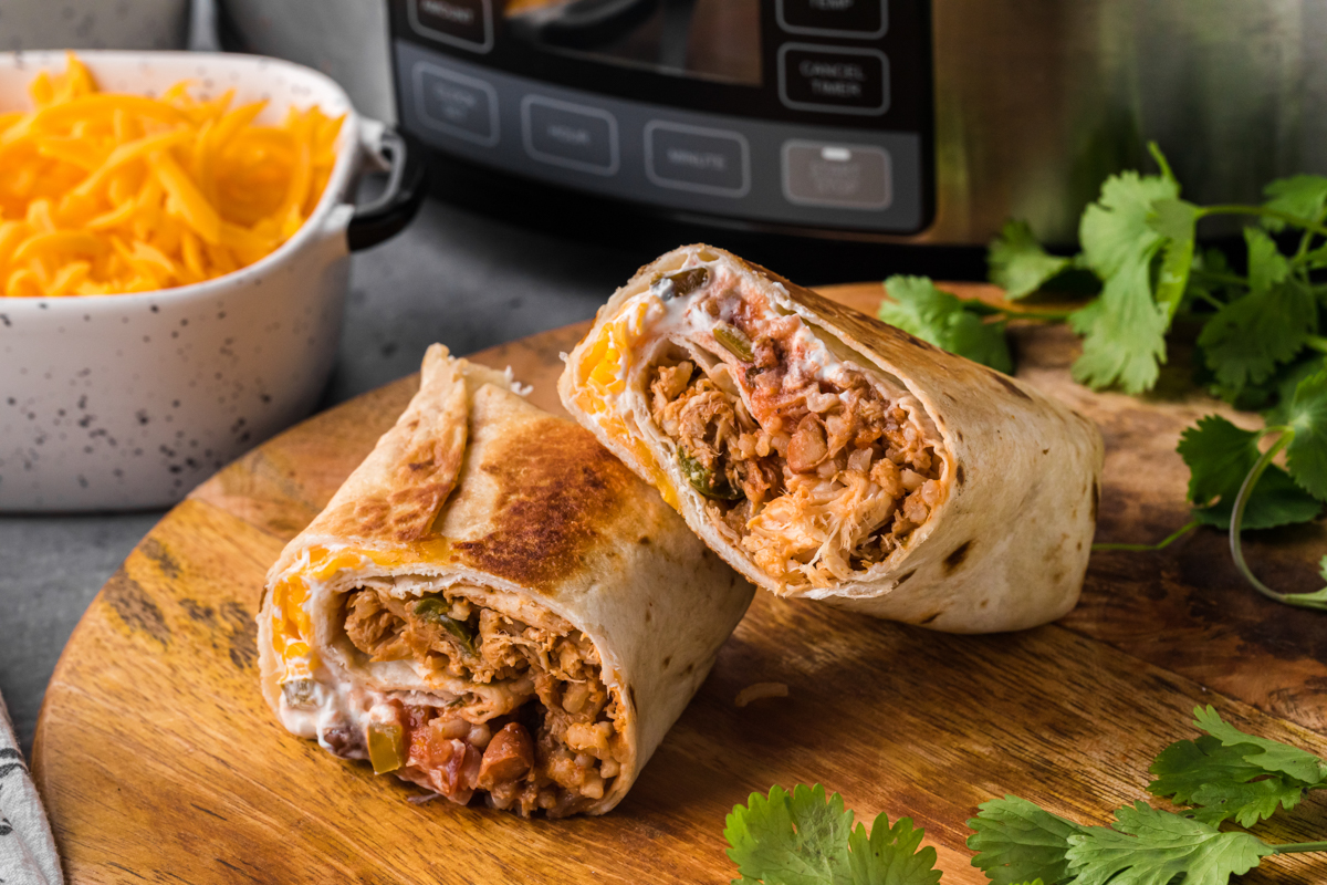 chicken burrito in front of a slow cooker.