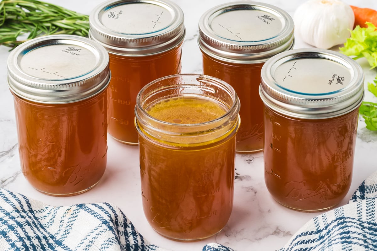 Chicken broth in jars.