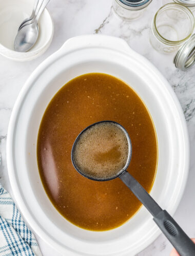 Chicken stock cooked in a slow cooker.