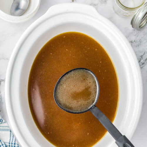 Chicken stock cooked in a slow cooker.