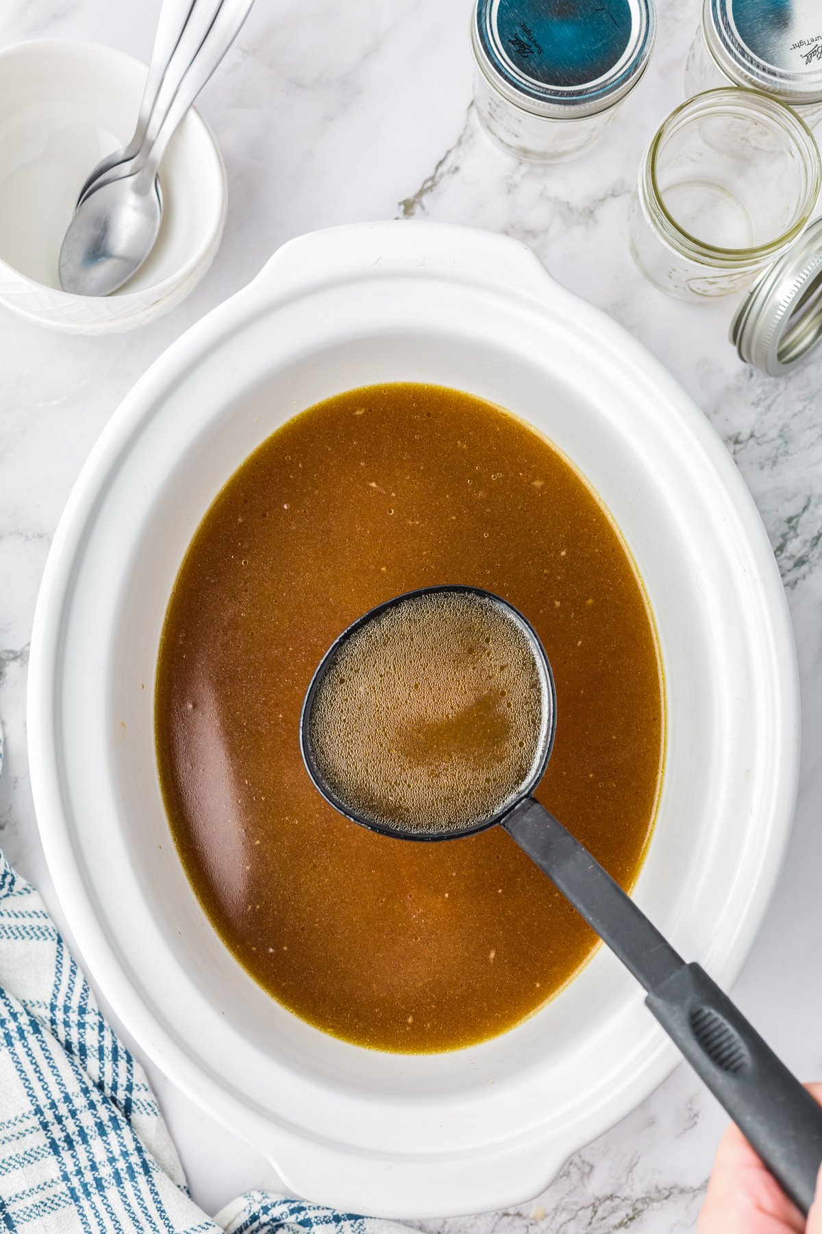 Chicken stock cooked in a slow cooker.