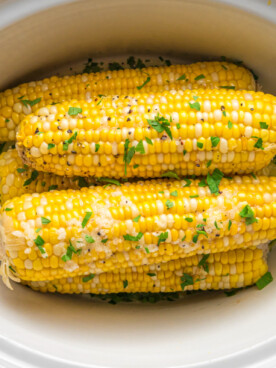 overhead shot of corn on the cob in a slow cooker.