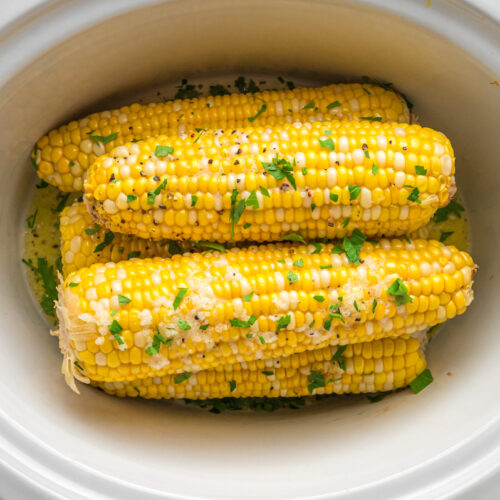 overhead shot of corn on the cob in a slow cooker.