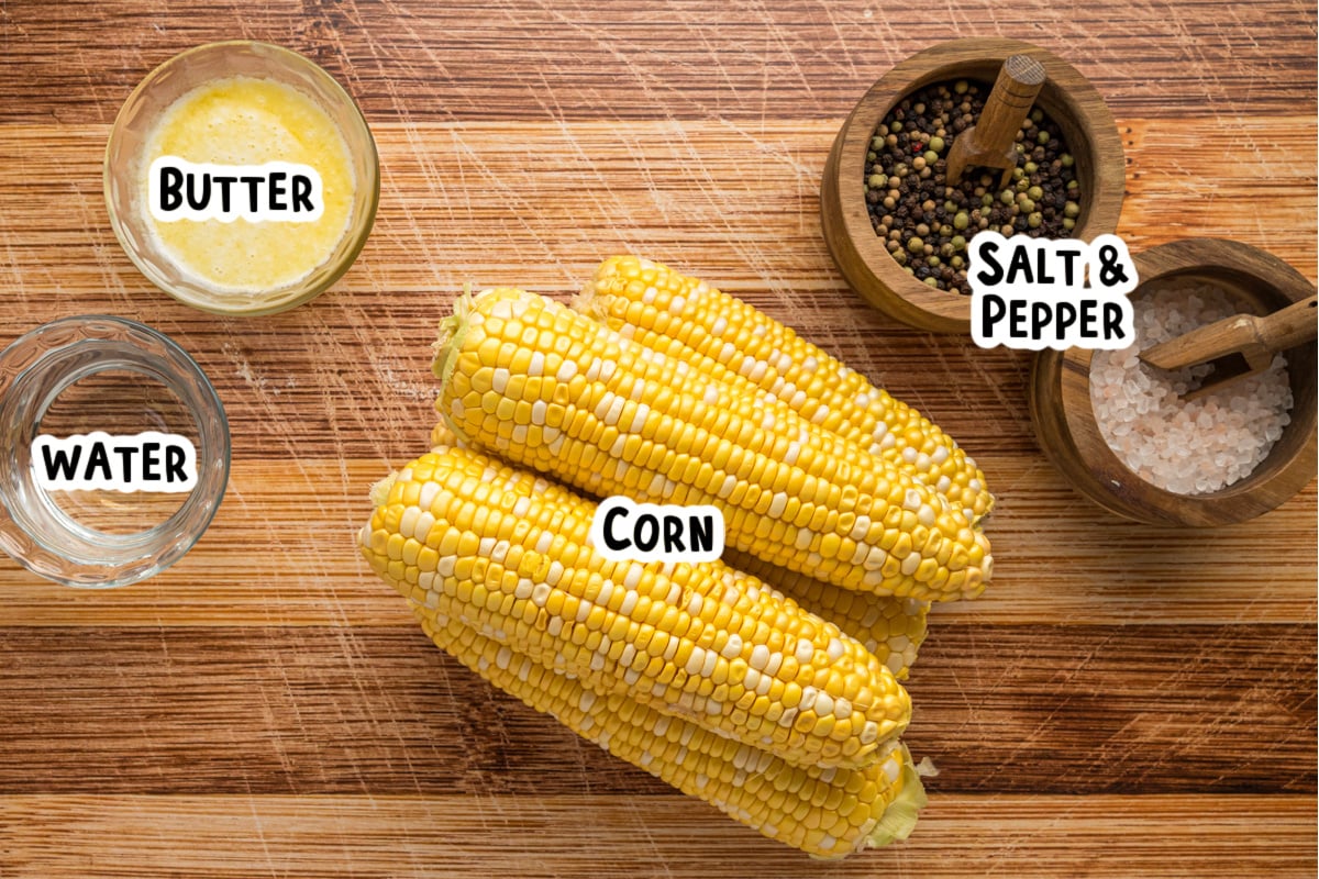 Ingredients for corn on the cob on a table.