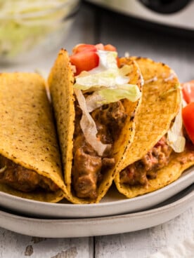 3 tacos on a plate.