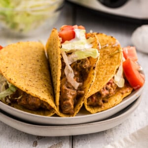 3 tacos on a plate.