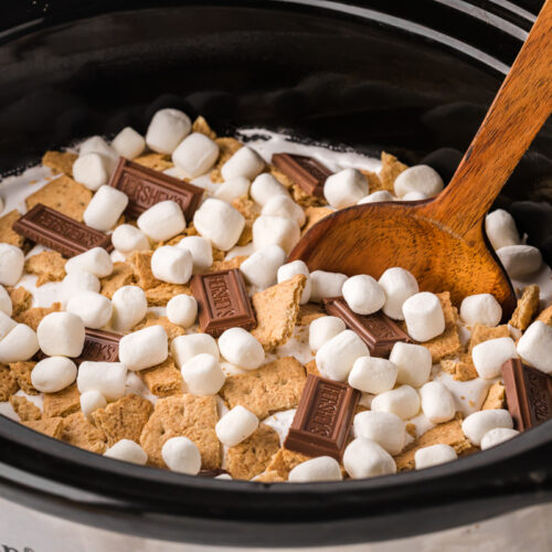 side view of chocolate cake with marshmallows and hershey bars.