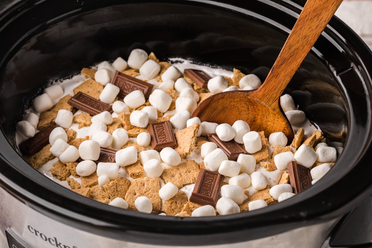 side view of chocolate cake with marshmallows and hershey bars.