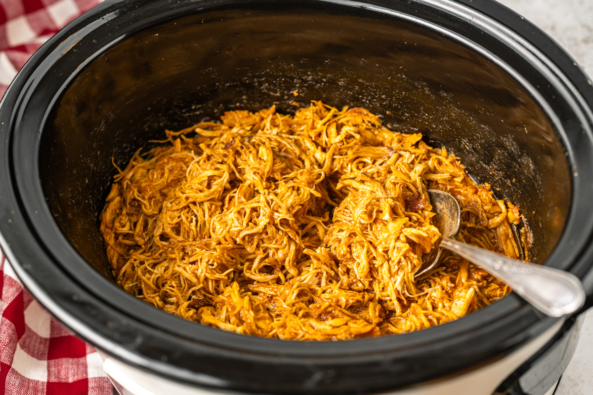 spicy chicken sandwich meat in a slow cooker.