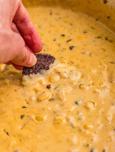 chip being dipped into corn dip.