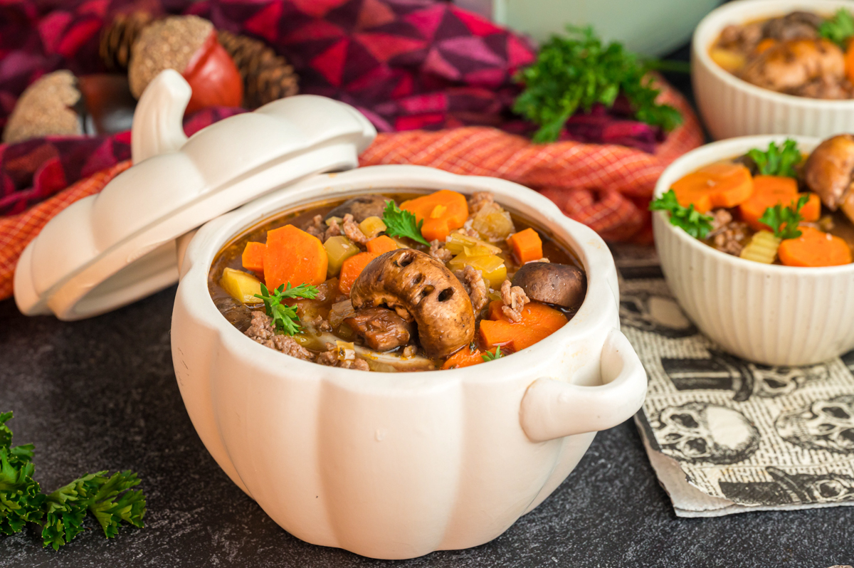 Stew in a white pumpkin bowl.