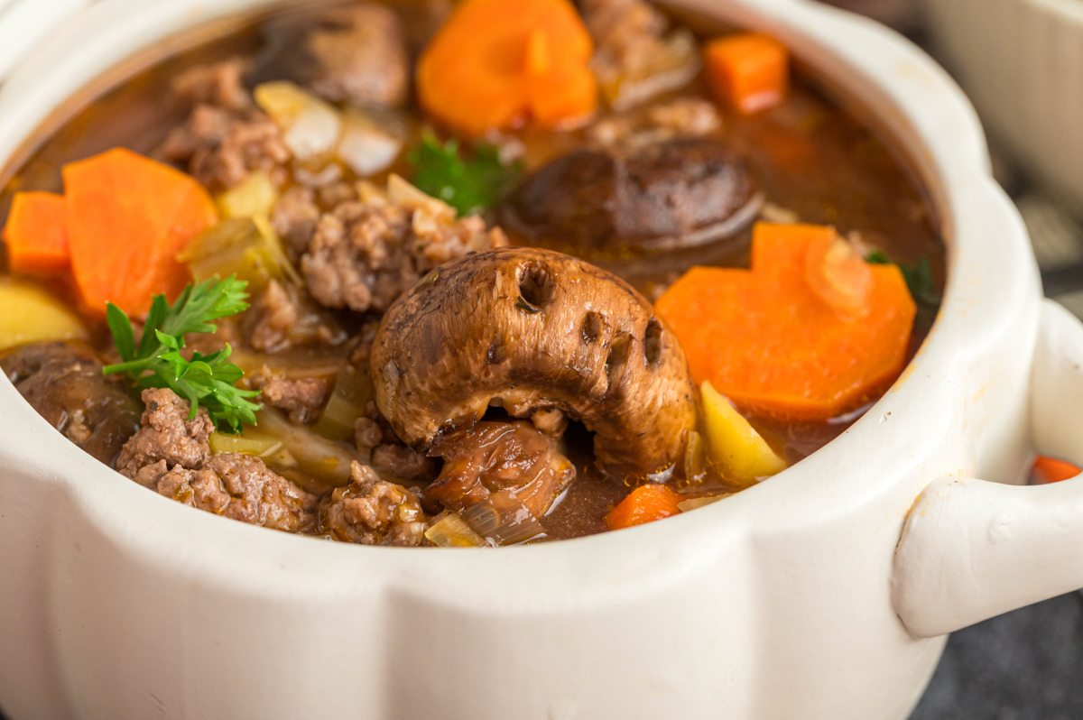 Close up of a skull mushroom in witches brew stew.