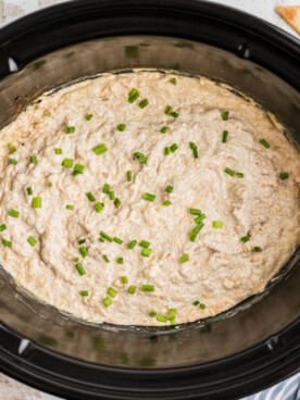 cooked french onion dip in a crockpot.