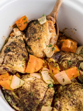 Chicken thighs with sweet potatoes and onions.
