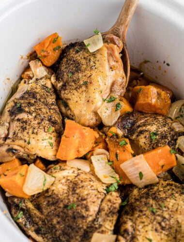Chicken thighs with sweet potatoes and onions.
