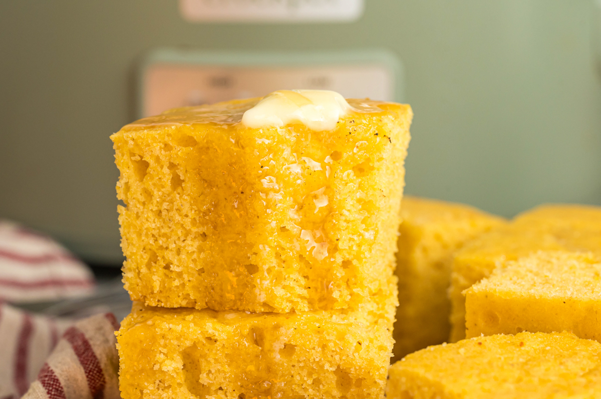 close up of cornbread with honey on top.