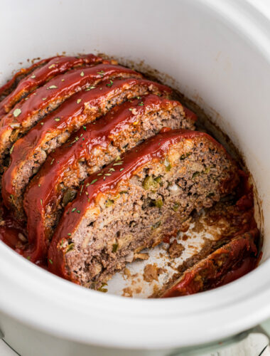 sliced meatloaf in a slow cooker.