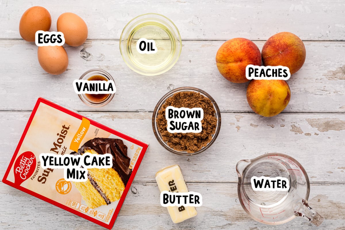 Ingredients for peach cake on a table.