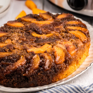 Peach upside down cake on a platter.