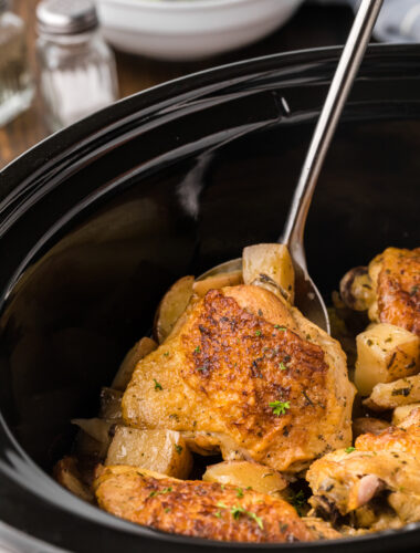 a chicken thigh on a spatula.