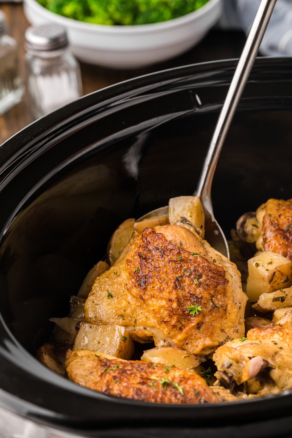 a chicken thigh on a spatula.