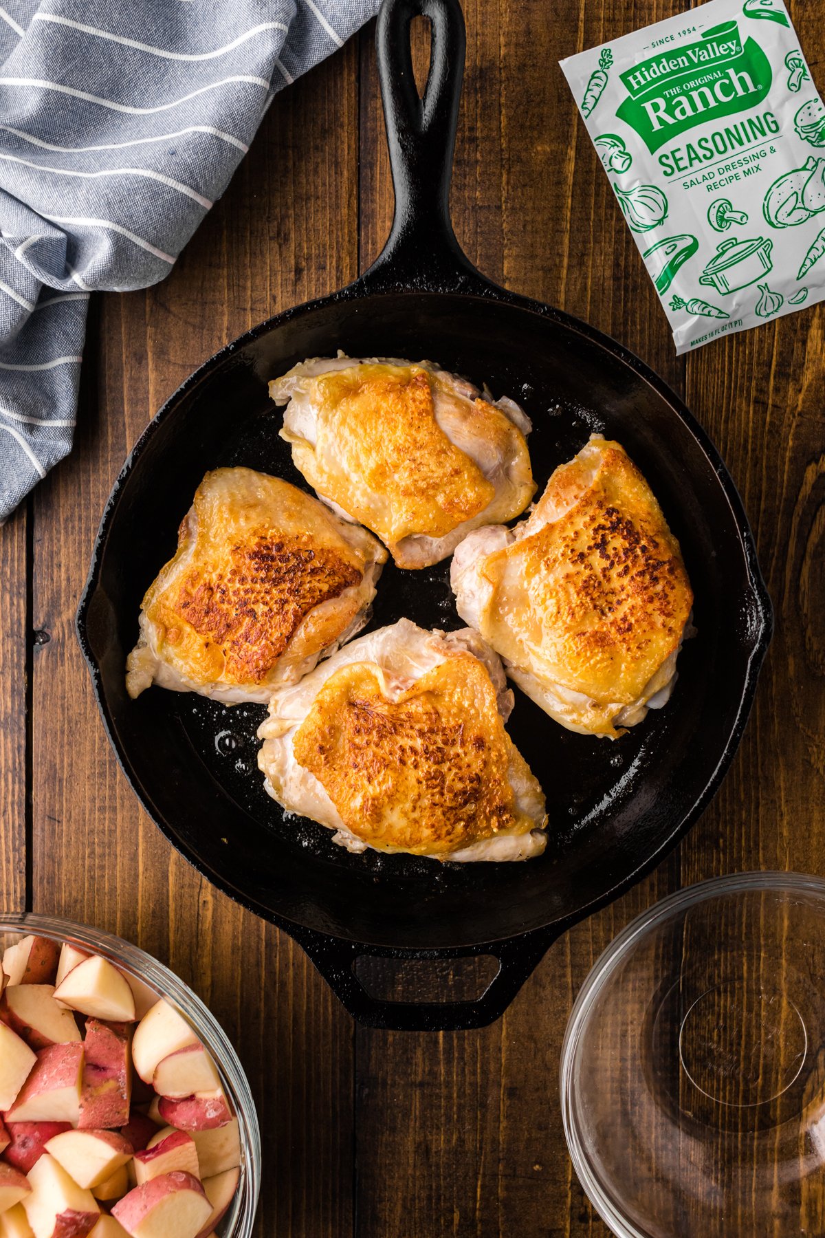 CHICKEN THIGHS In a skillet, browning.