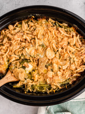thanksgiving casserole done cooking in a black crockpot.