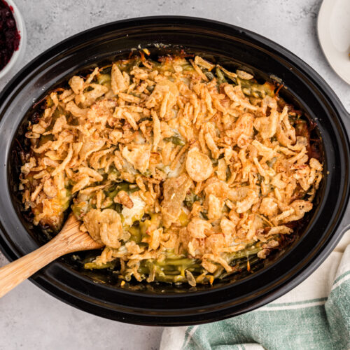 thanksgiving casserole done cooking in a black crockpot.