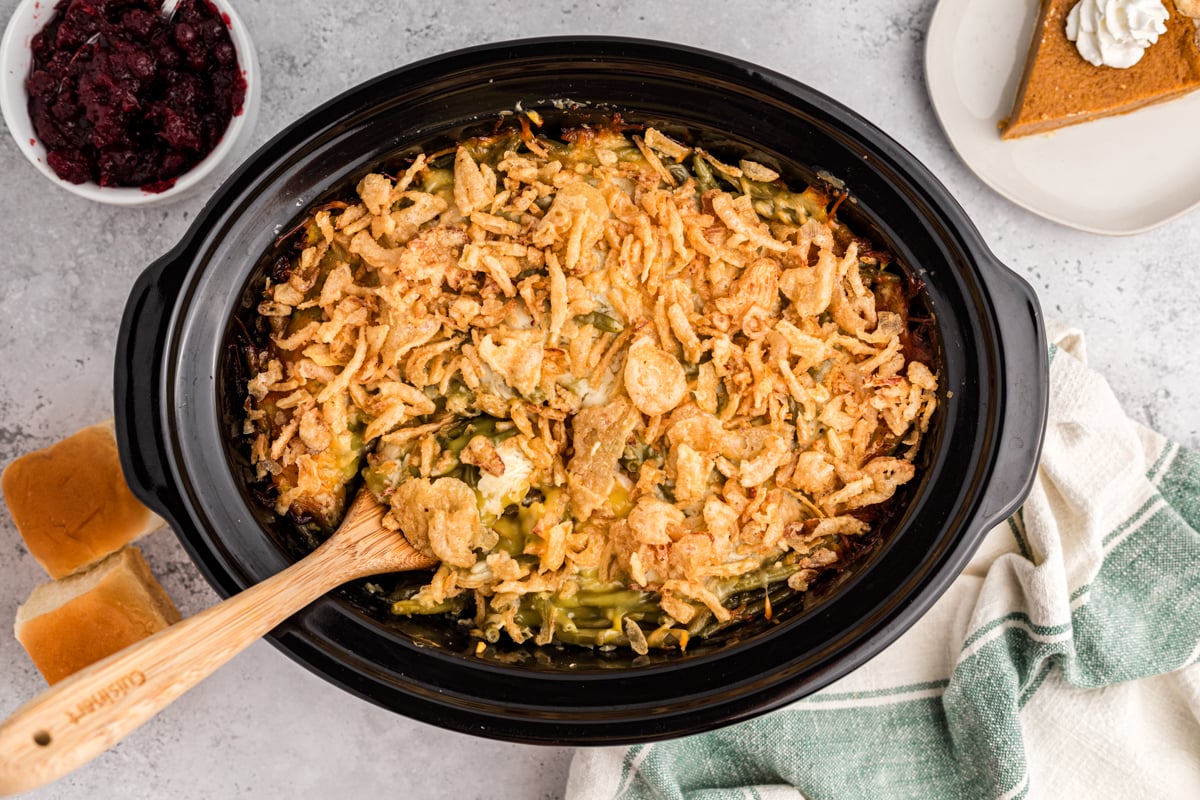 thanksgiving casserole done cooking in a black crockpot.