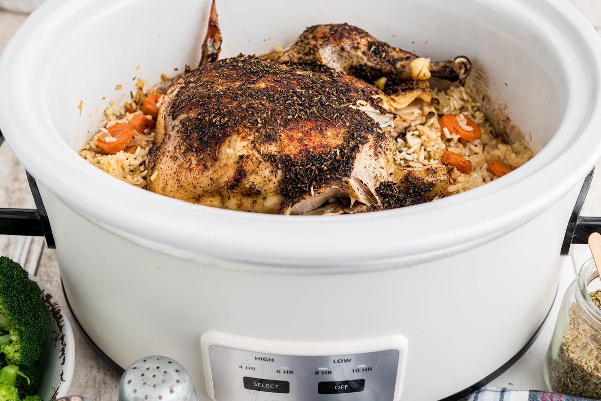 whole chicken in a slow cooker with rice.