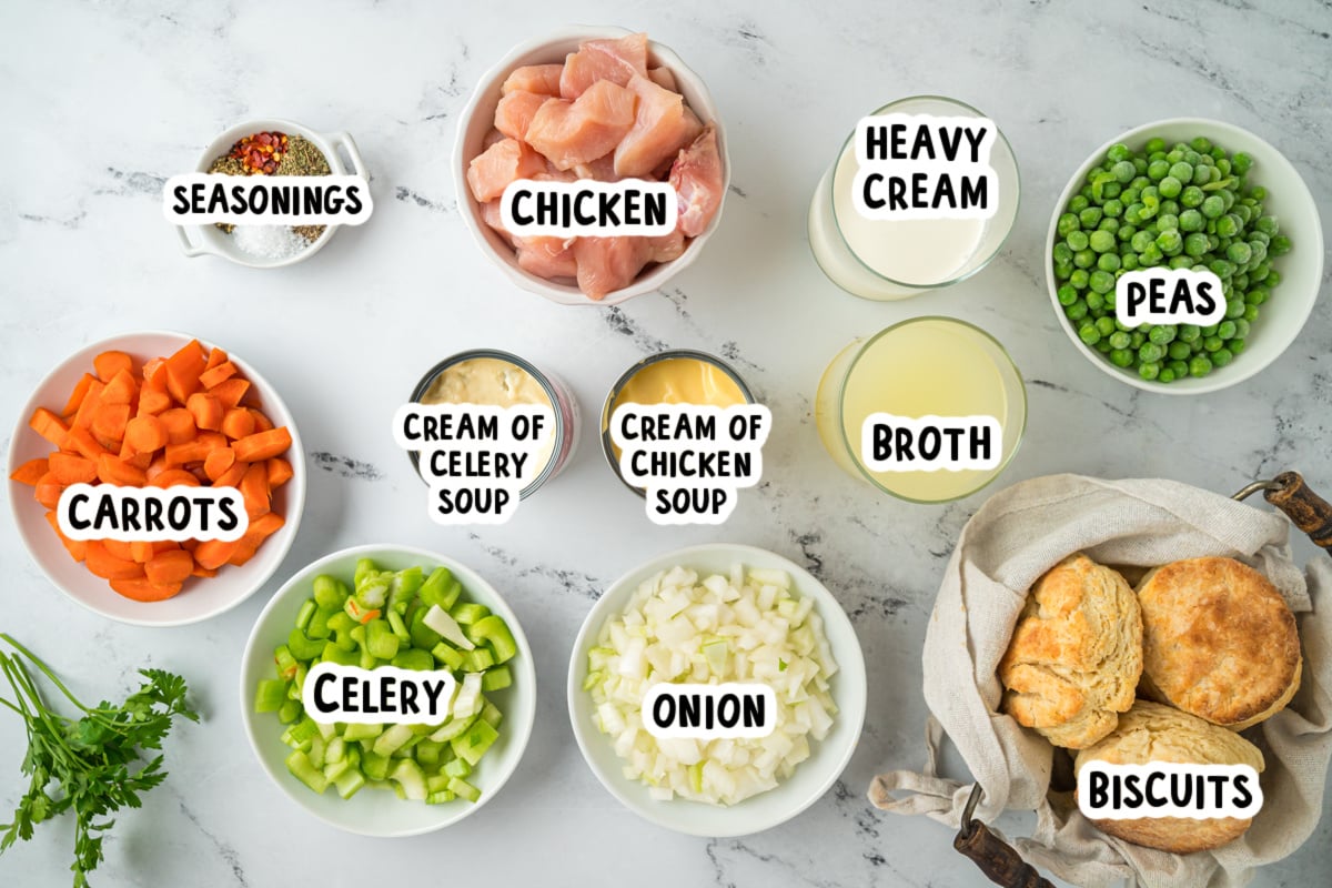 Ingredients for chicken pot pie on a marble surface.