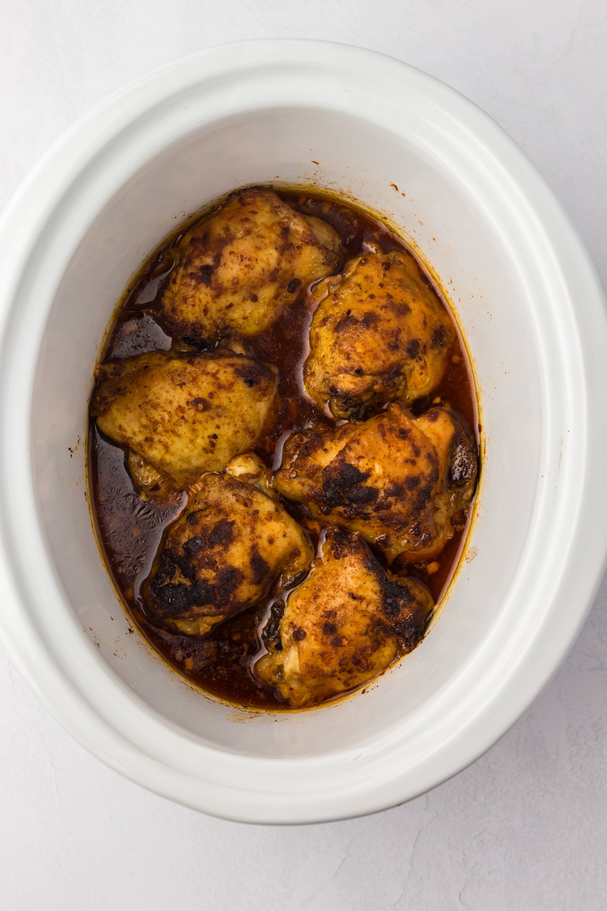 done cooking chicken thighs in broth in crockpot.