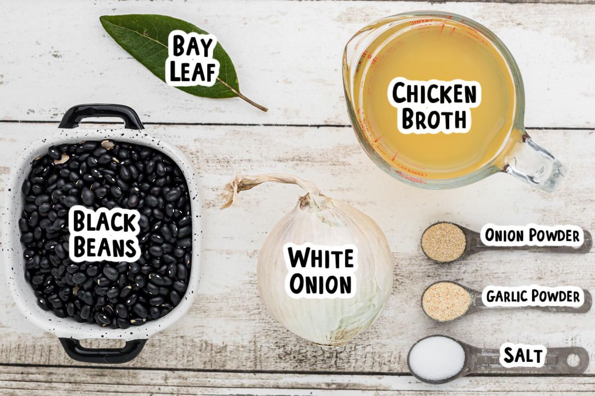Ingredients for crockpot black bean on a table with text overlay.