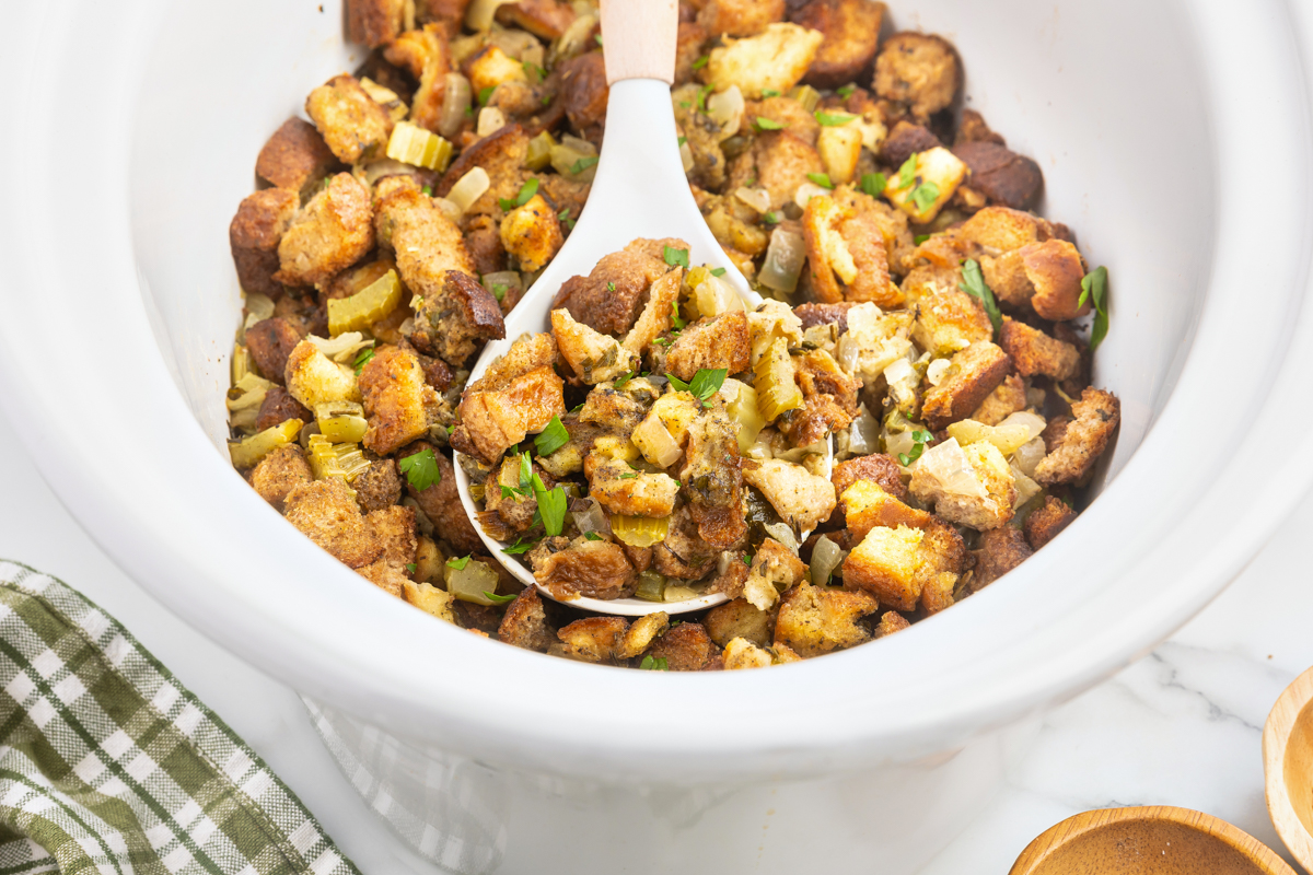 slow cooker stuffing on a spoon.