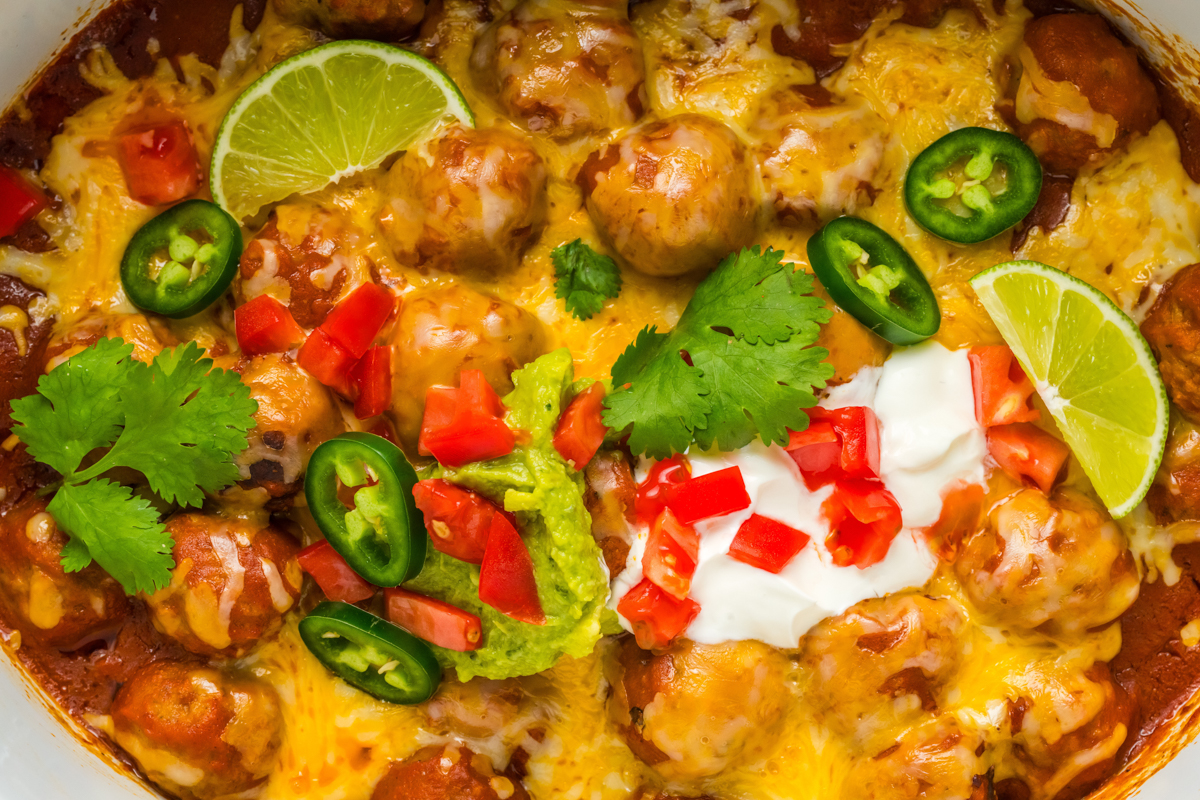 close-up of slow cooker enchilada meatballs.