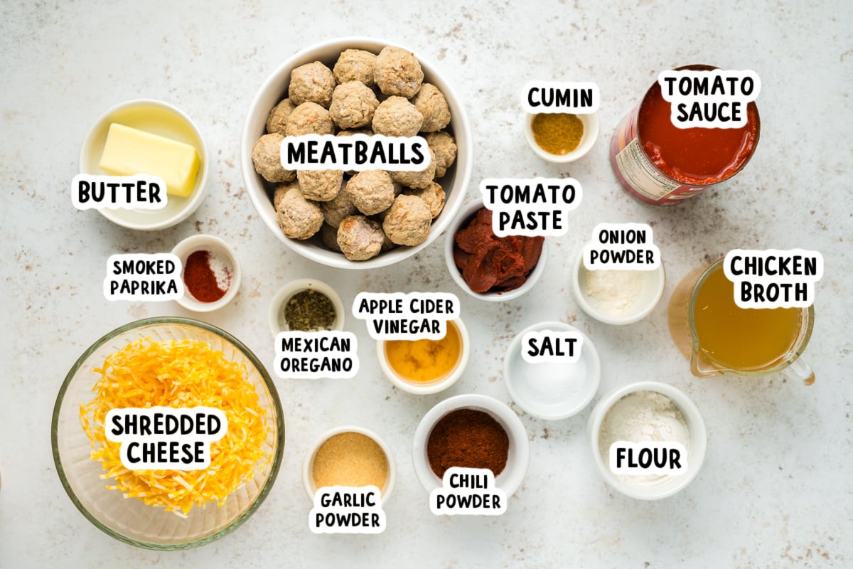 ingredients for slow cooker enchilada meatballs on a table.