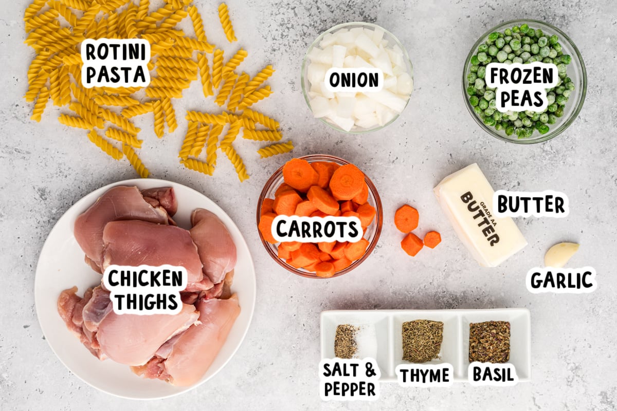 ingredients for slow cooker garlic butter chicken and pasta on a table.