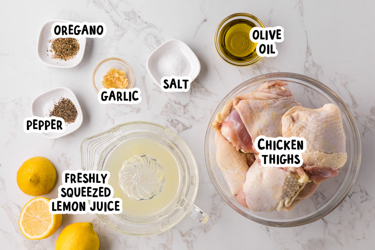 ingredients for slow cooker lemon pepper chicken thighs on a table.