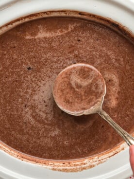hot chocolate with Nutella in a white slow cooker.