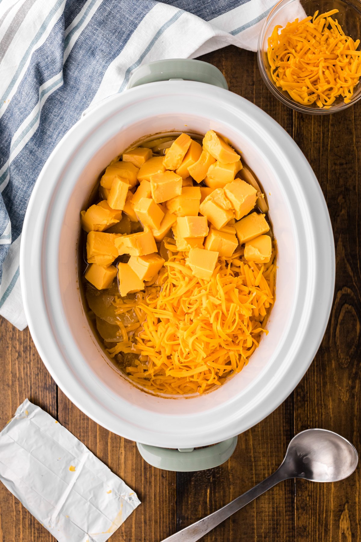 2 types of cheeses added to the soup in the slow cooker.