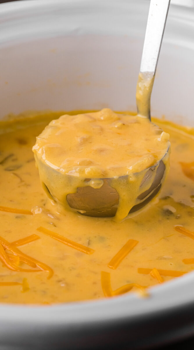 Long image of potato cheese soup in a crockpot.