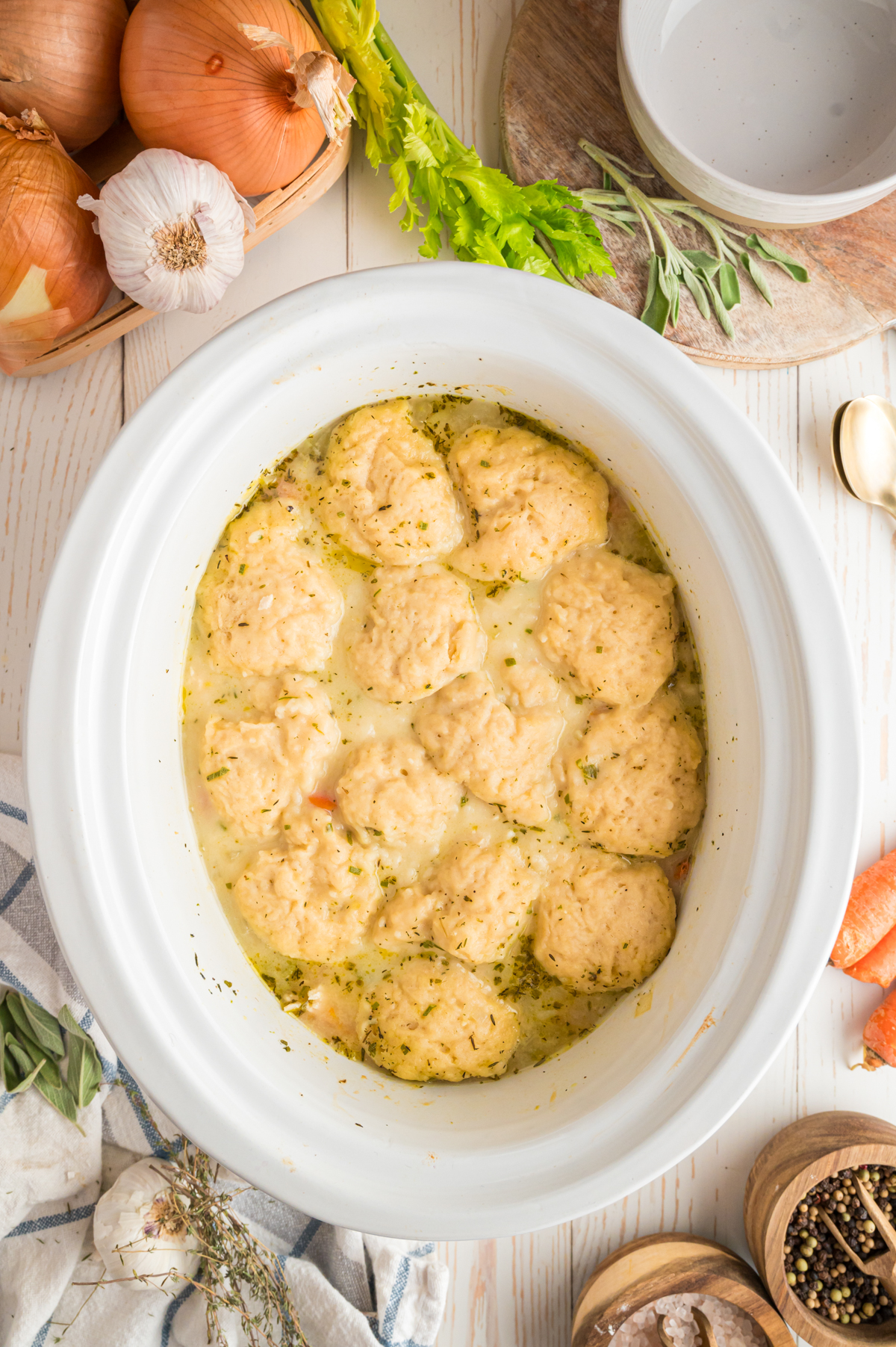 Cooked turkey and dumplings in a slow cooker.