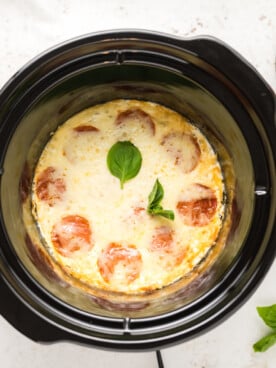 overhead of white pizza dip in a slow cooker.