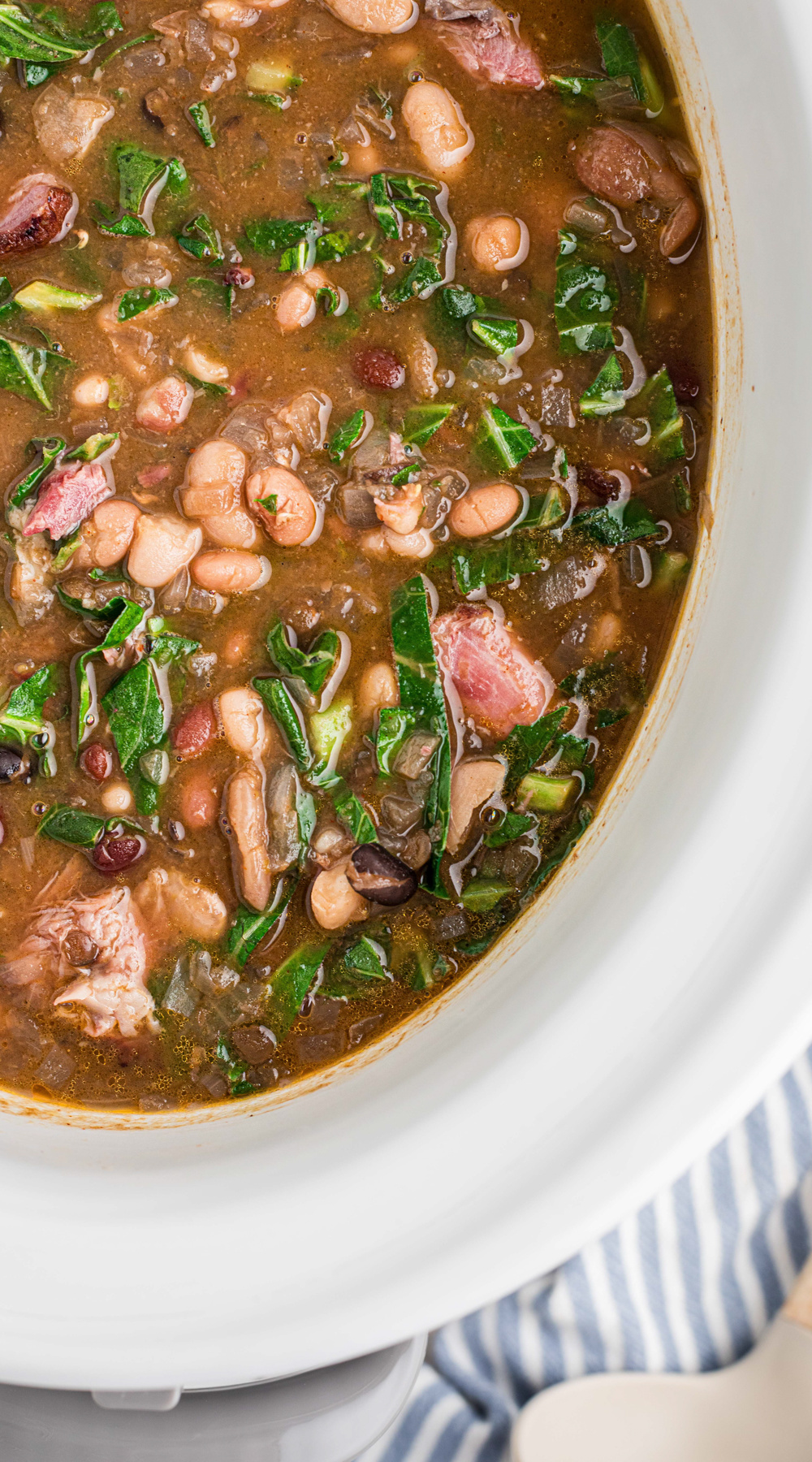 long image of slow cooker 15 bean soup with ham and collard greens.