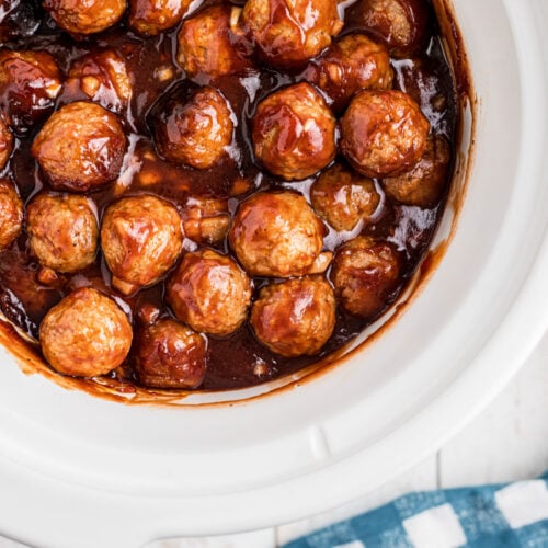 overhead of bbq meatballs in a slow cooker.