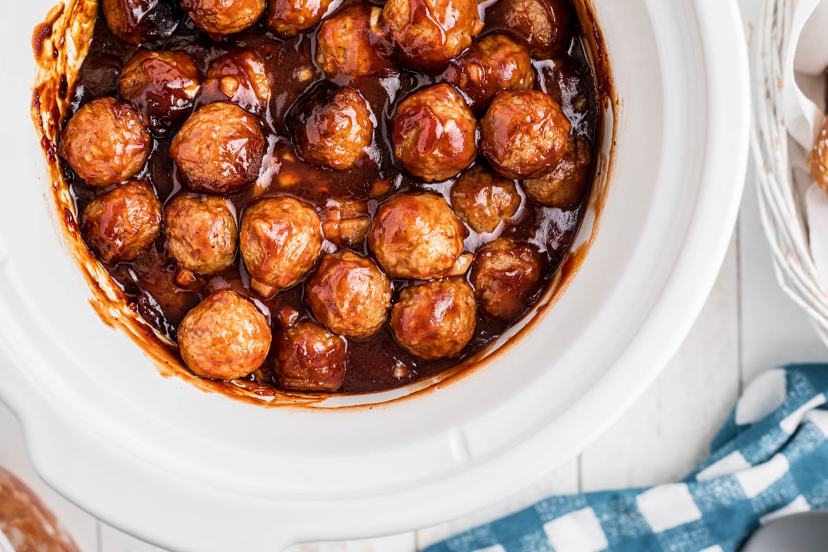overhead of bbq meatballs in a slow cooker.