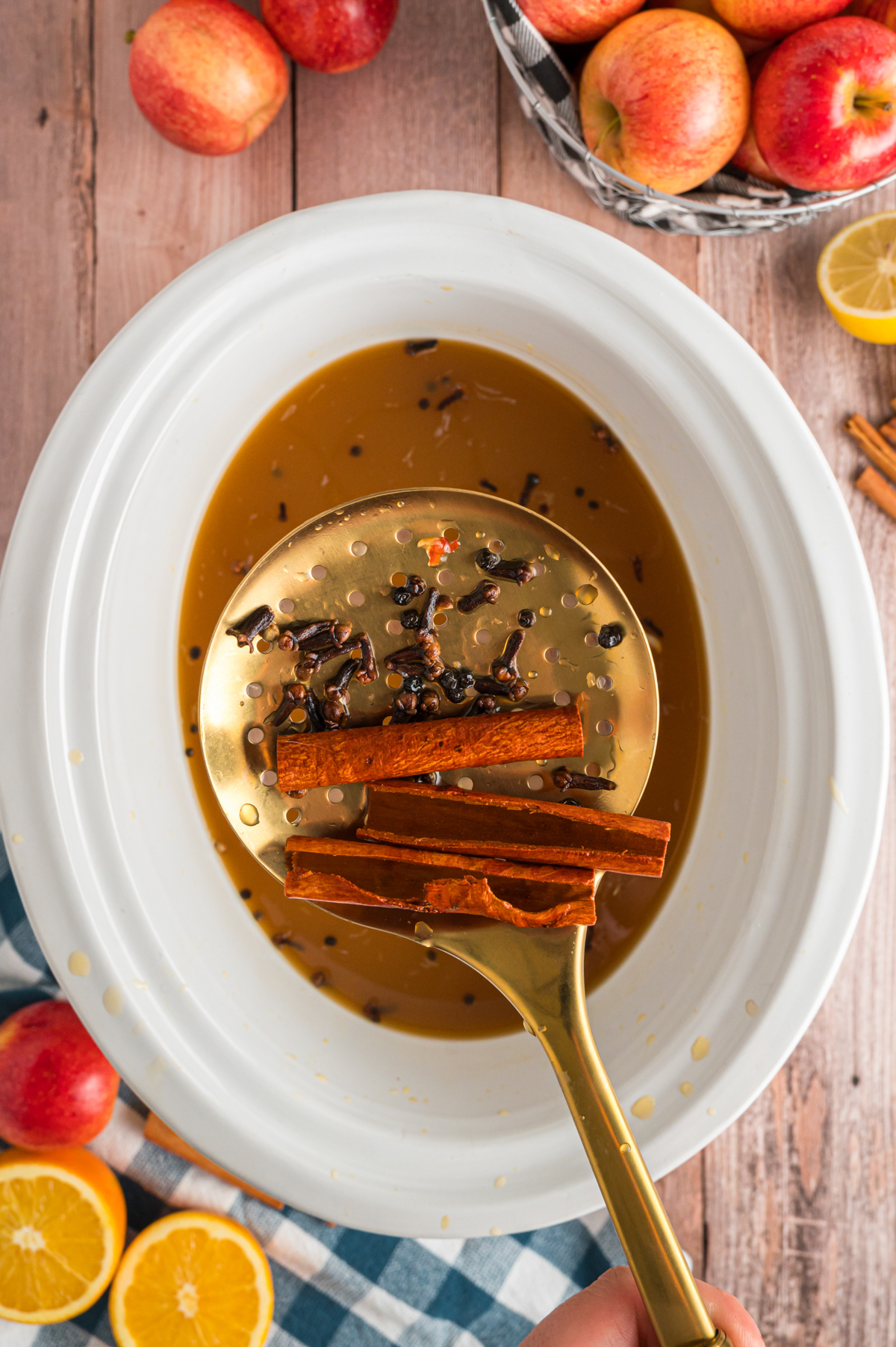 apple cider being strained.