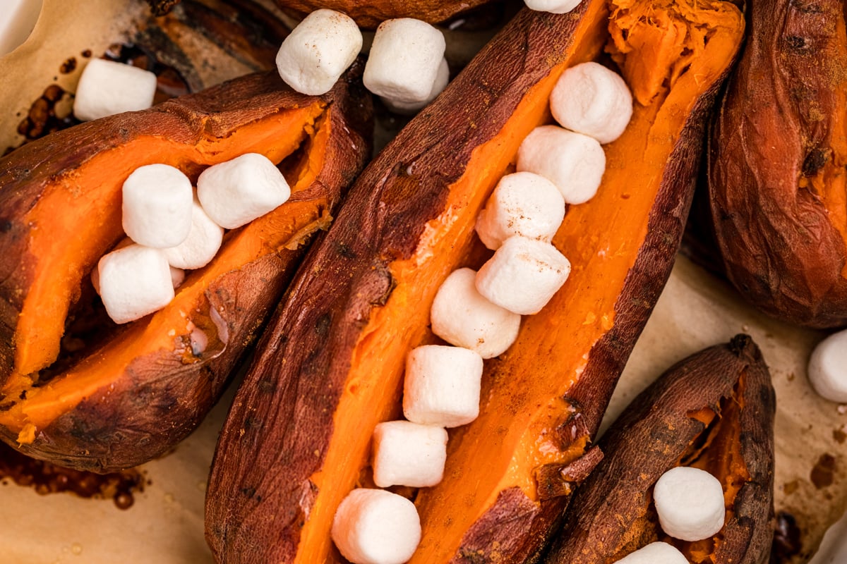 close-up of slow cooker sweet potatoes with marshmallows on top.