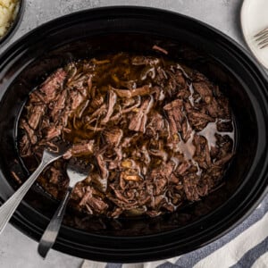 overhead of balsamic beef in a slow cooker.